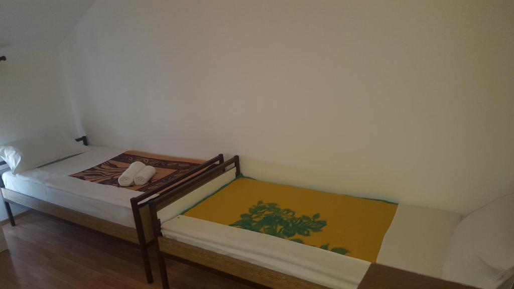 Postel nebo postele na pokoji v ubytování Hostel Vera - Airport Podgorica