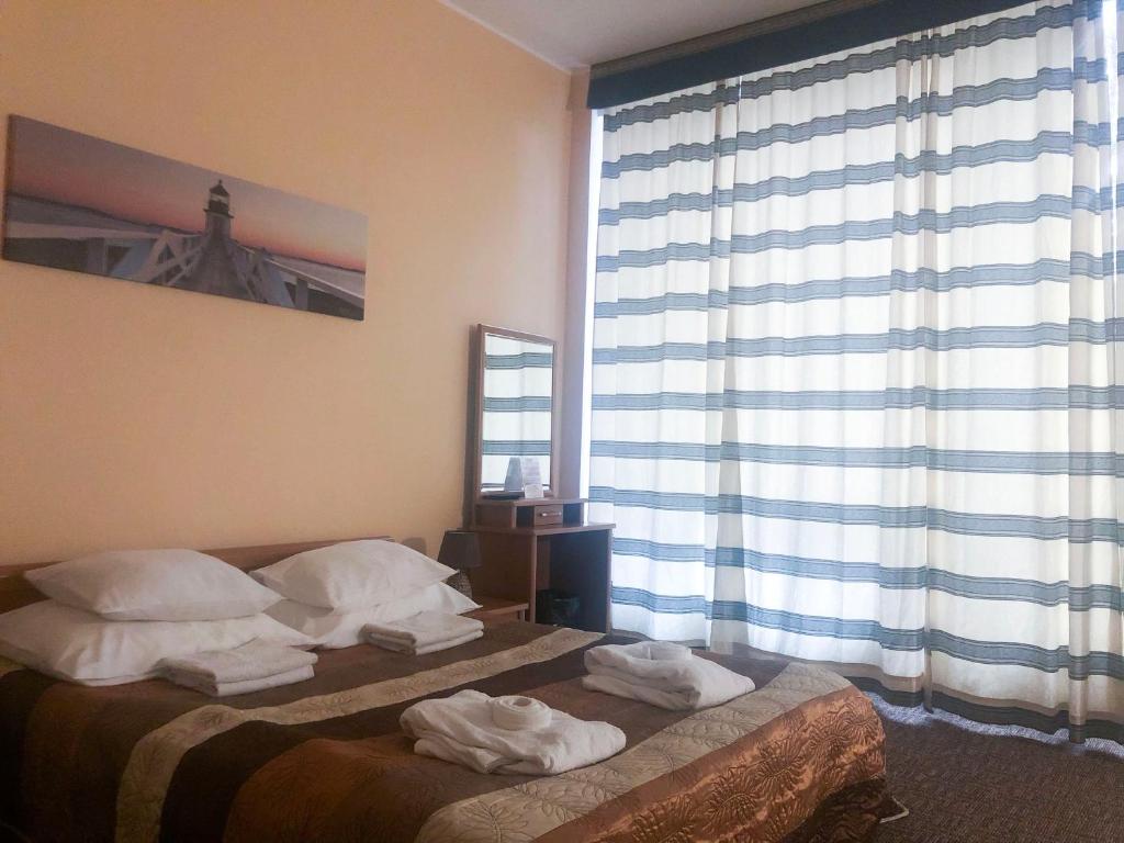 Postel nebo postele na pokoji v ubytování Hotel Yes