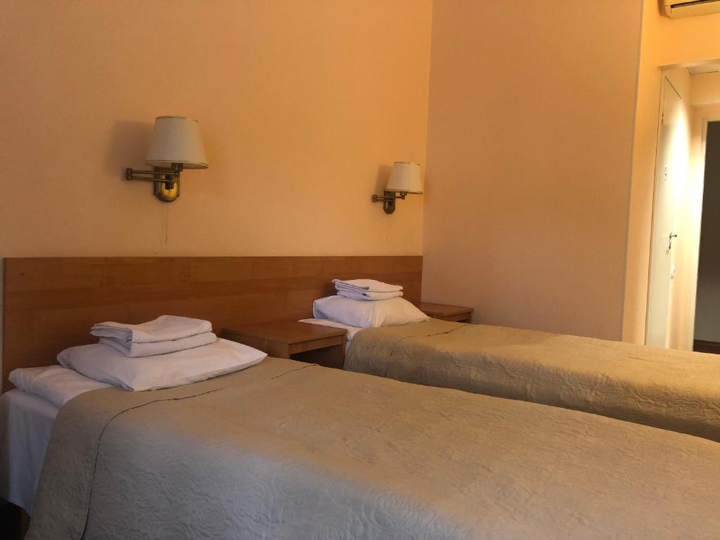 Postel nebo postele na pokoji v ubytování Hotel Yes
