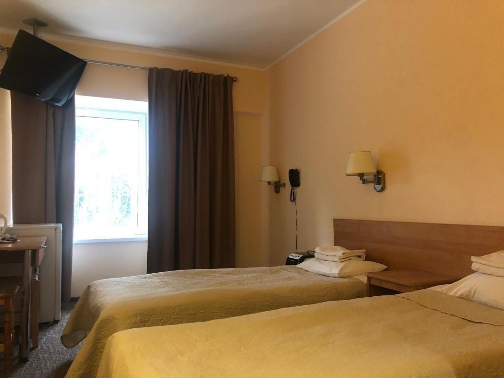 Postel nebo postele na pokoji v ubytování Hotel Yes