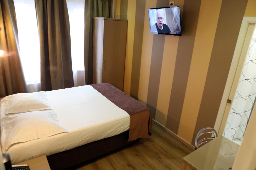 Postel nebo postele na pokoji v ubytování Hotel Phenix