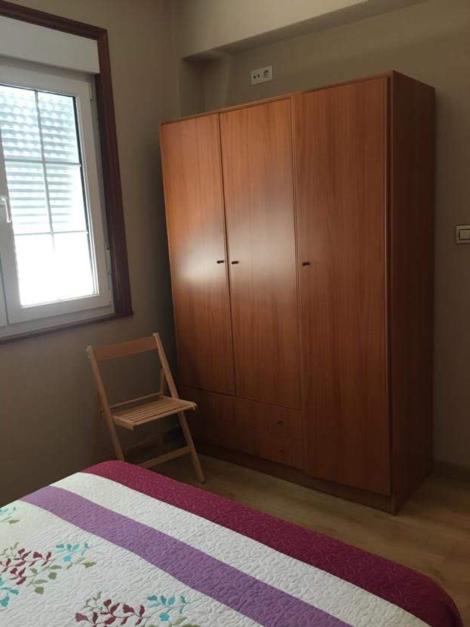 A bed or beds in a room at Pisos Turísticos Muxía -Teresa Barros