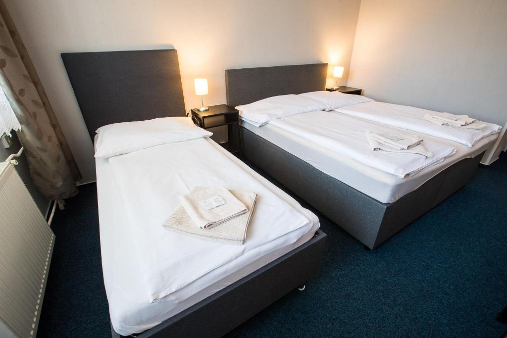 Postel nebo postele na pokoji v ubytování A-Sport Hotel