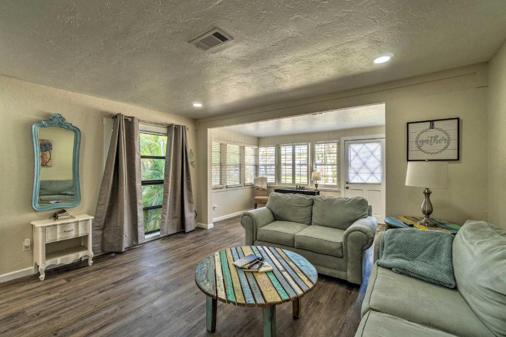 a living room with a couch and a table at Quiet and Cozy Sarasota House with Yard Pet Friendly! in Sarasota