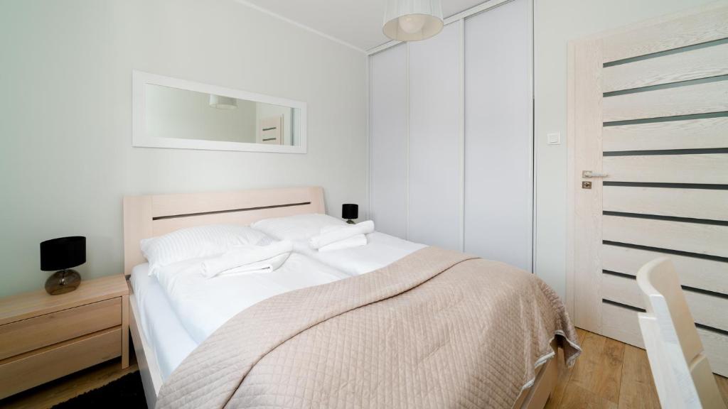 Posteľ alebo postele v izbe v ubytovaní Apartamenty Sun & Snow Sarnia Residence