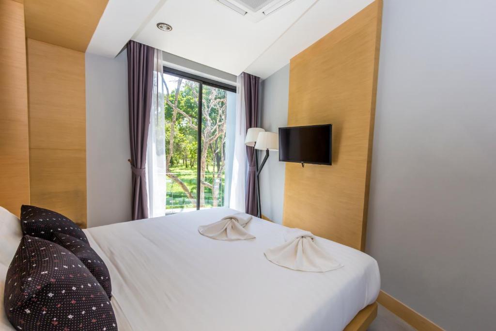 Postel nebo postele na pokoji v ubytování Apple A Day Resort Krabi, Ao Nang Beach