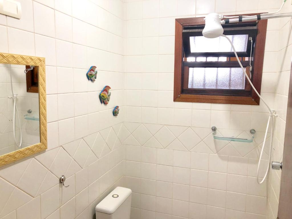  Uma Casa Feliz Pertinho da Praia pra Relaxar
