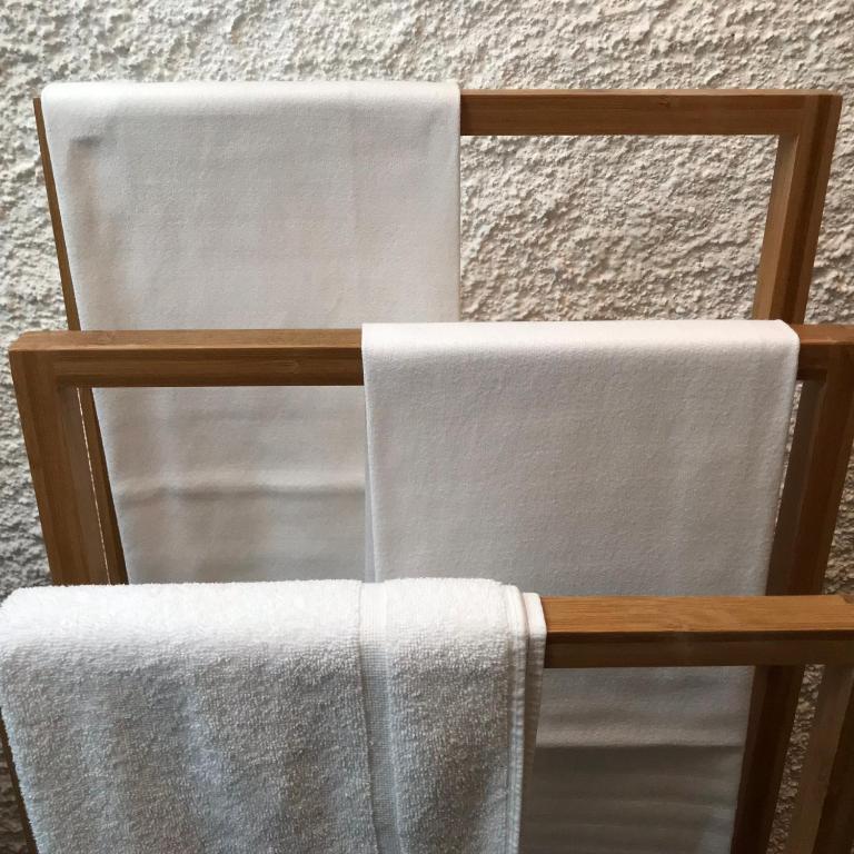 a towel on the back of a wooden chair at il Magàn - Cinque Terre in Corniglia