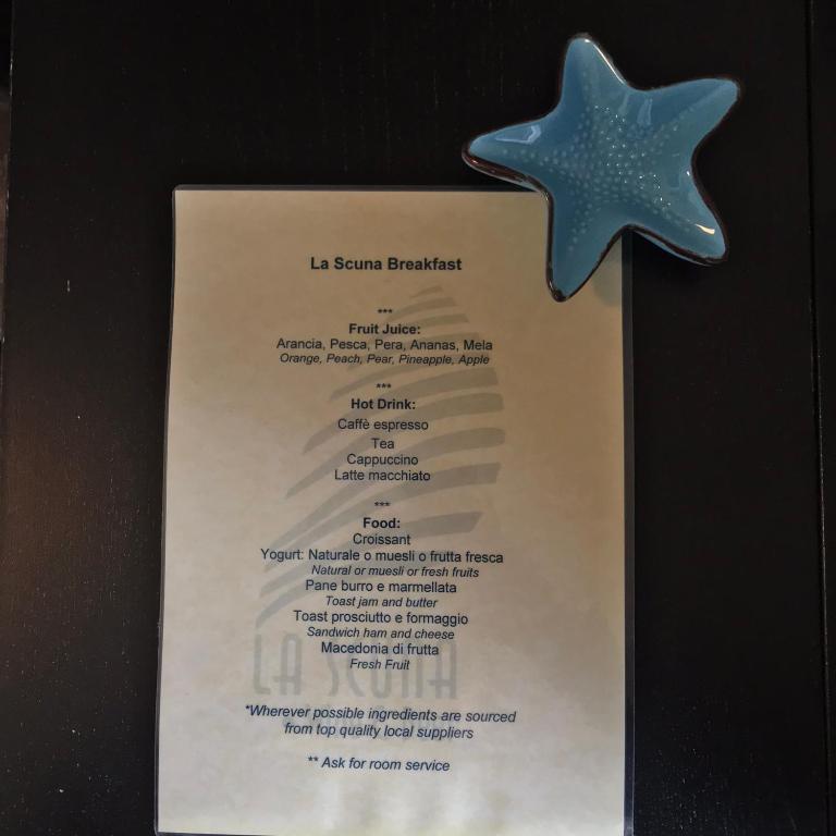 a starfish on top of a menu on a wall at il Magàn - Cinque Terre in Corniglia