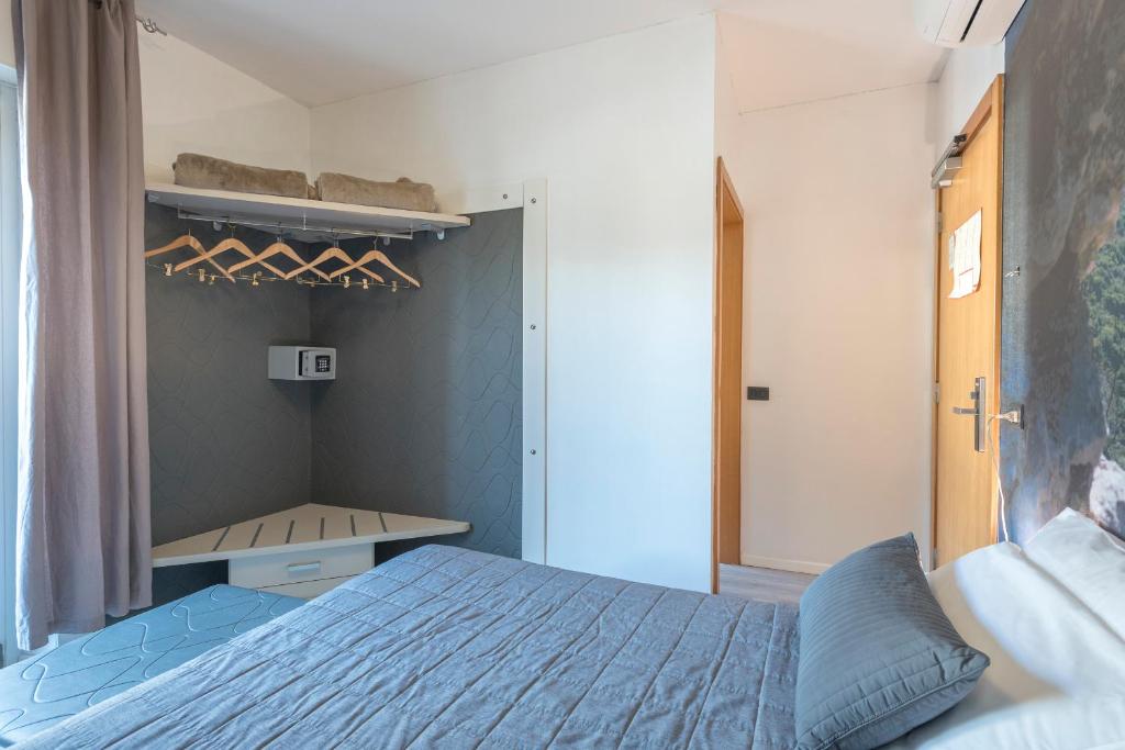 Postel nebo postele na pokoji v ubytování Hotel Rubino