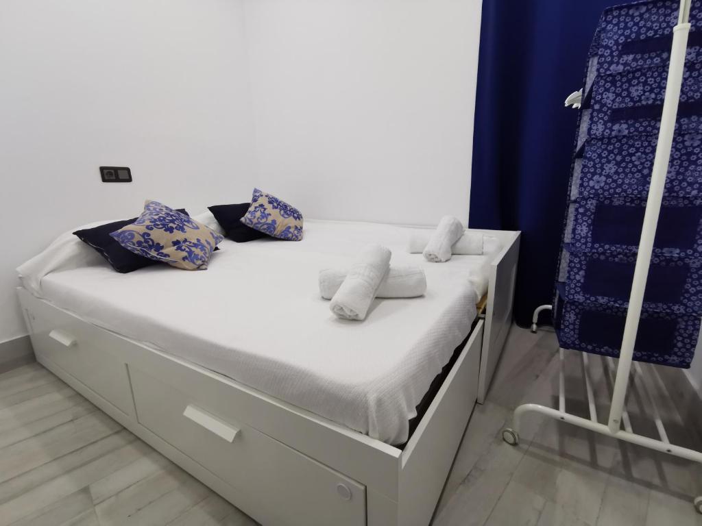 Łóżko lub łóżka w pokoju w obiekcie Apartamento Centro San Diego