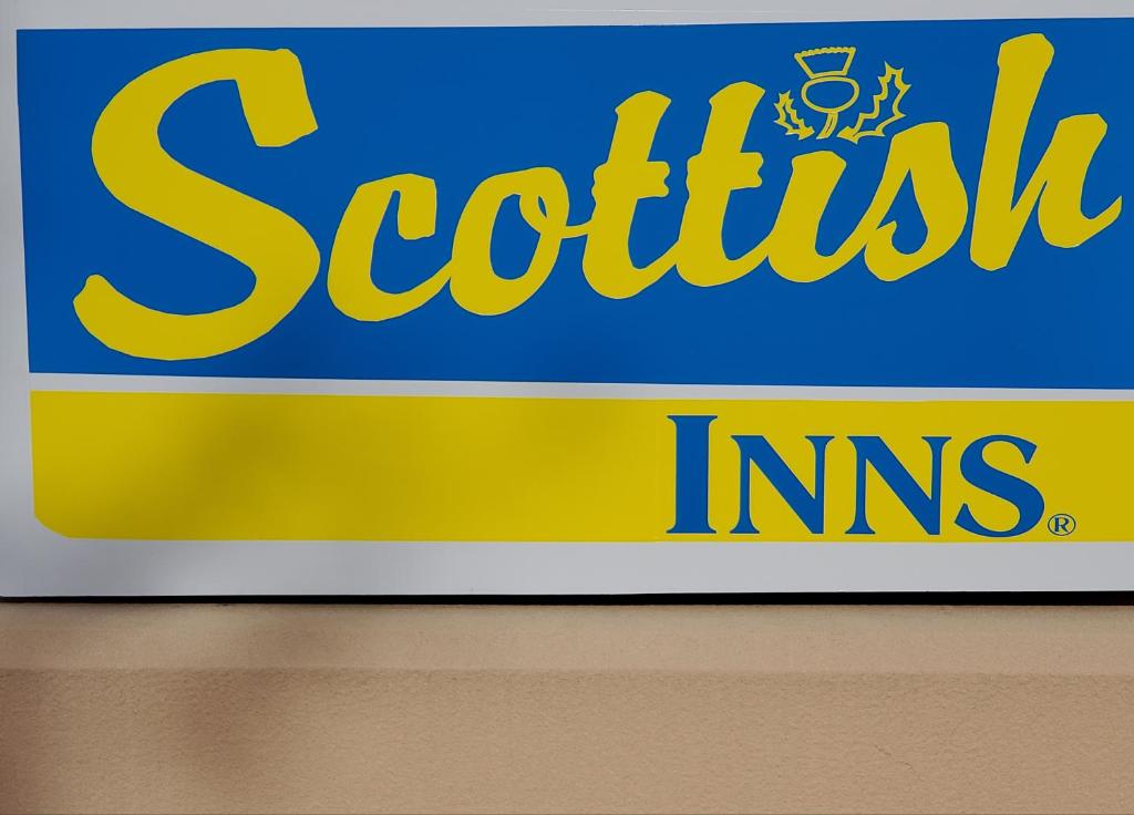 a sign for a scottish inc store at Scottish Inn Whippany in Whippany