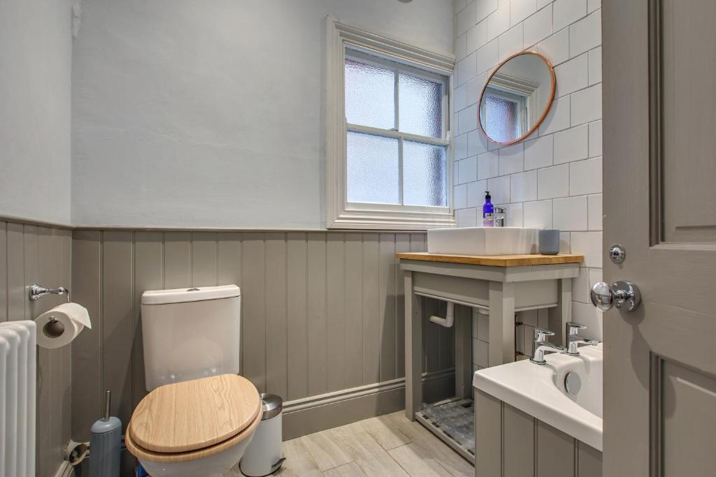 a bathroom with a toilet and a sink at The Sands Sheringham in Sheringham
