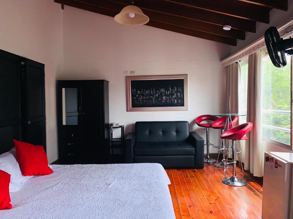 Postel nebo postele na pokoji v ubytování Hotel Lleras Premium #1