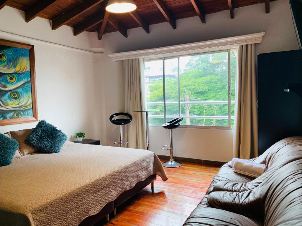 Postel nebo postele na pokoji v ubytování Hotel Lleras Premium #1