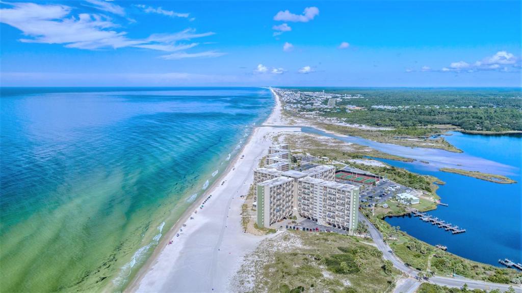 an aerial view of a beach and the ocean at Pinnacle Port Beach Resort in Panama City Beach