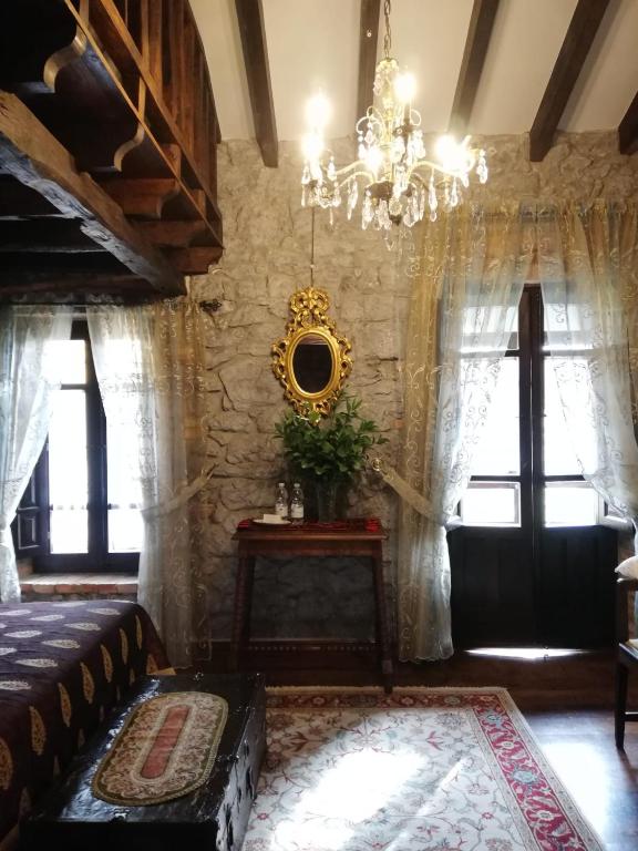 A bed or beds in a room at Posada de Pedreña