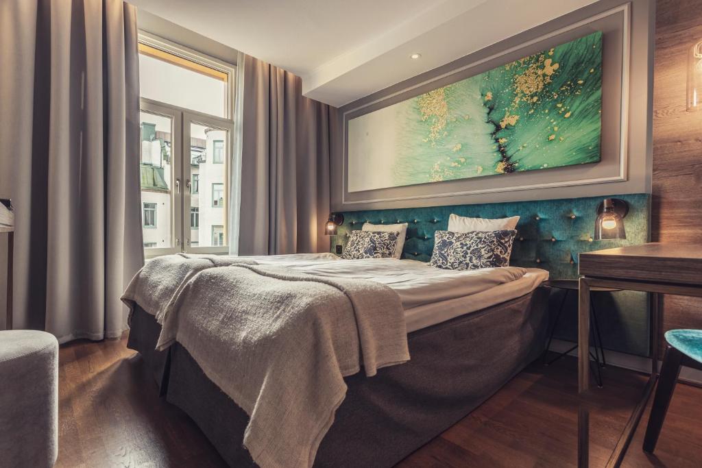 Postel nebo postele na pokoji v ubytování Hotel Poseidon