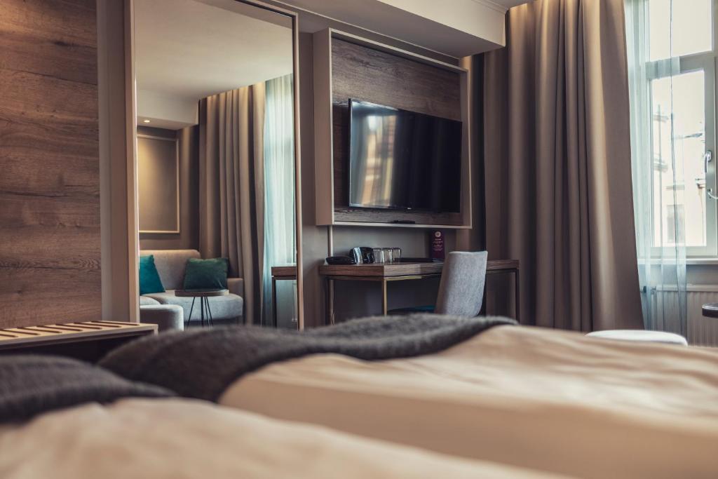 Postel nebo postele na pokoji v ubytování Hotel Poseidon