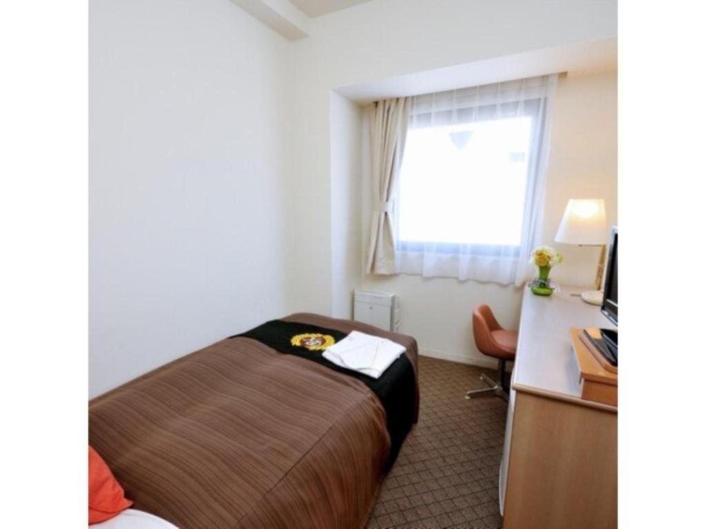 Säng eller sängar i ett rum på Grand Park Hotel Panex Kimitsu / Vacation STAY 77110
