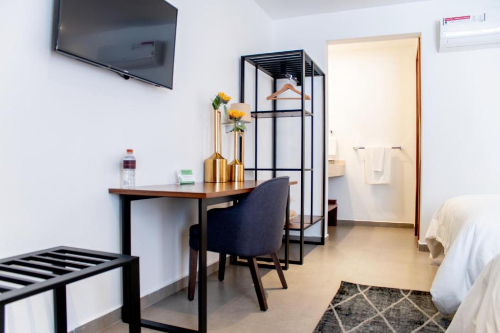 Postel nebo postele na pokoji v ubytování HOTEL MINA REAL MATEHUALA