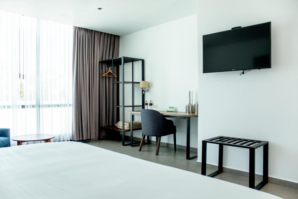TV a/nebo společenská místnost v ubytování HOTEL MINA REAL MATEHUALA