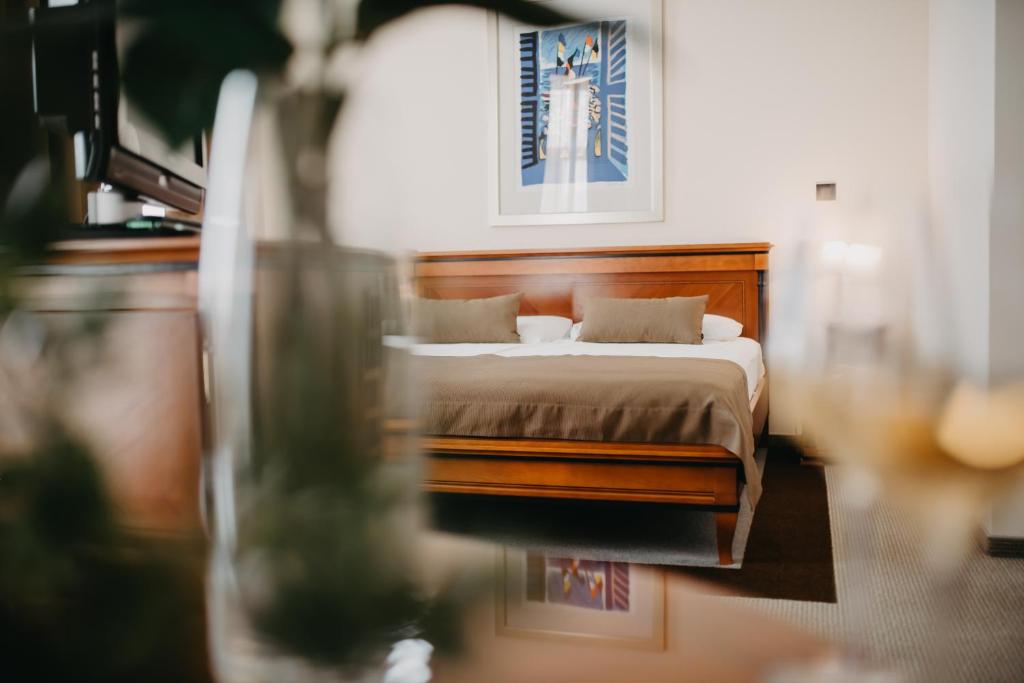Łóżko lub łóżka w pokoju w obiekcie Hotel Villa Eugenia