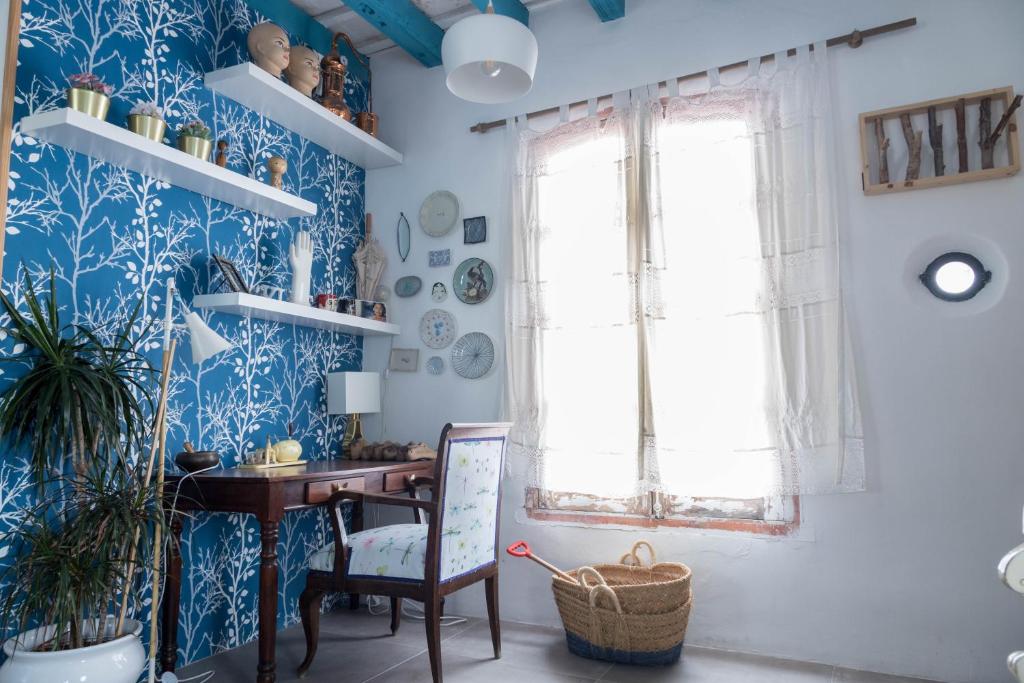 a home office with blue and white wallpaper at Penthouse Torre del Mar Grupo AC Gestion in Cádiz