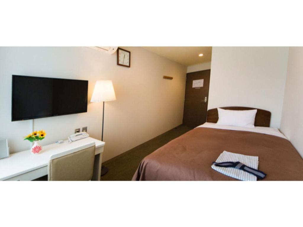 A bed or beds in a room at Grand Park Hotel Kazusa / Vacation STAY 77378