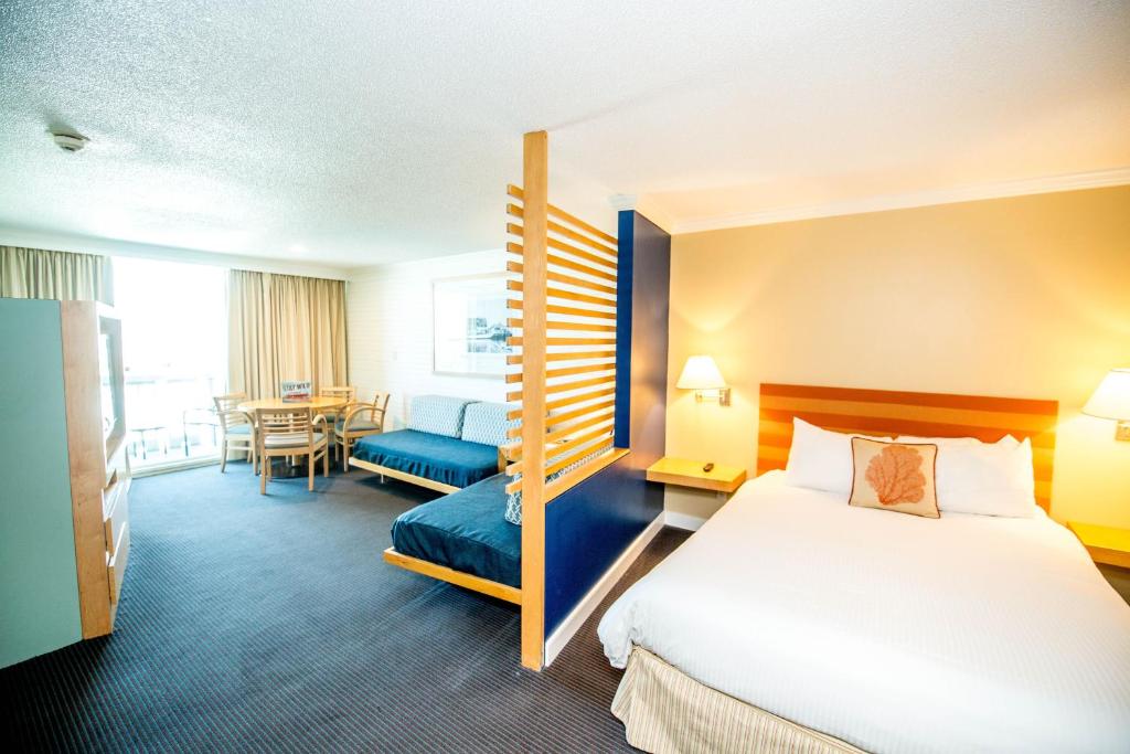 a hotel room with a bed and a desk at Port Royal Oceanfront Hotel in Wildwood Crest