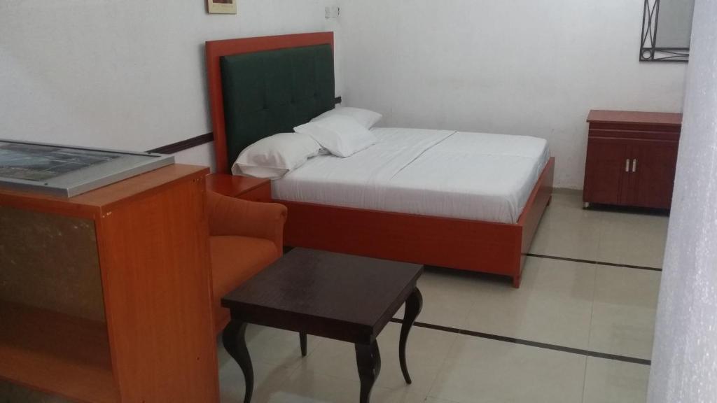 Postel nebo postele na pokoji v ubytování JCB Hotel