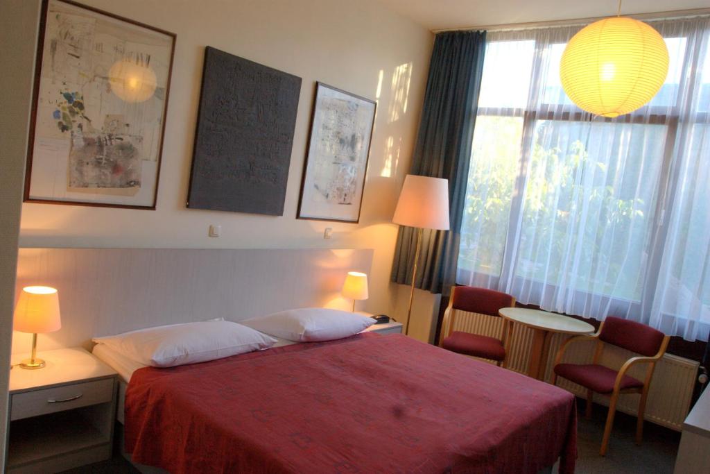 Postel nebo postele na pokoji v ubytování Berlin ART Hotel