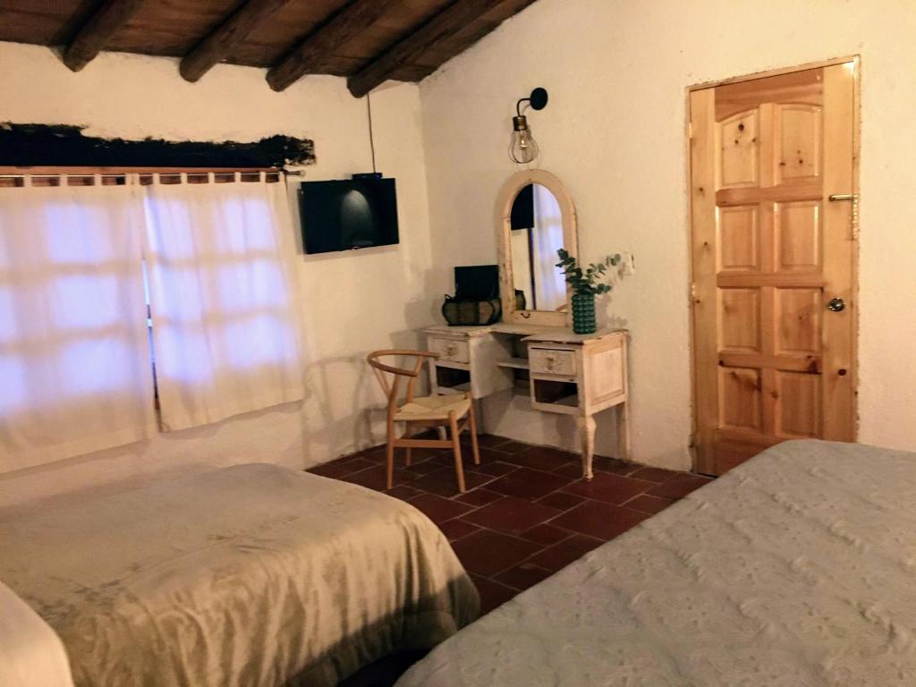 Postel nebo postele na pokoji v ubytování Hotel Del Rio