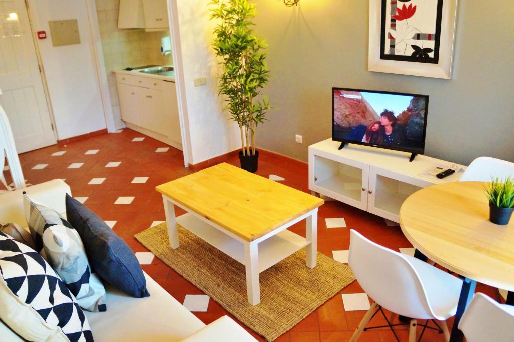Телевизор и/или развлекательный центр в Baluarte da Vila Apartments