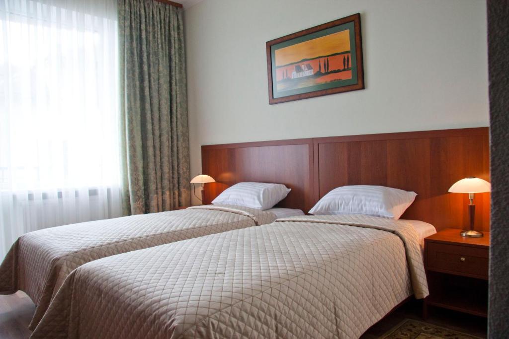 Postel nebo postele na pokoji v ubytování Hotel Re Vita