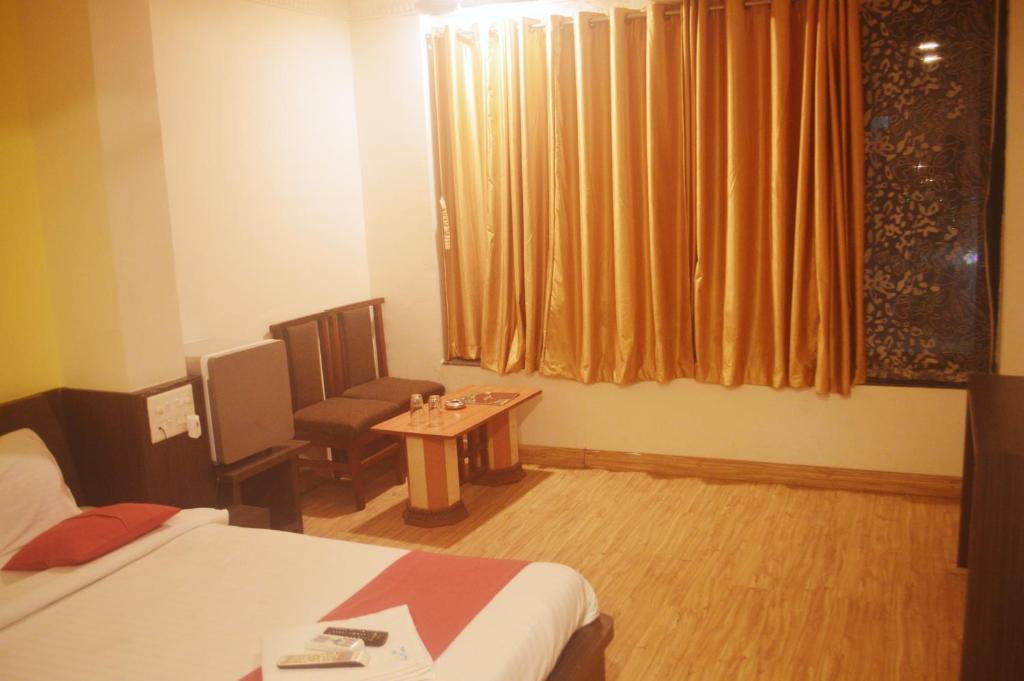 Postel nebo postele na pokoji v ubytování Hotel Sunrise N Resorts