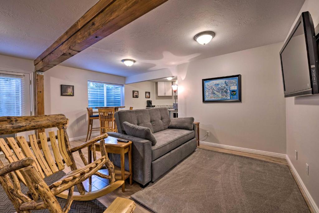 a living room with a couch and a tv at Updated Home with Mtn Views 8 Mi to Snowbird Resort in Sandy