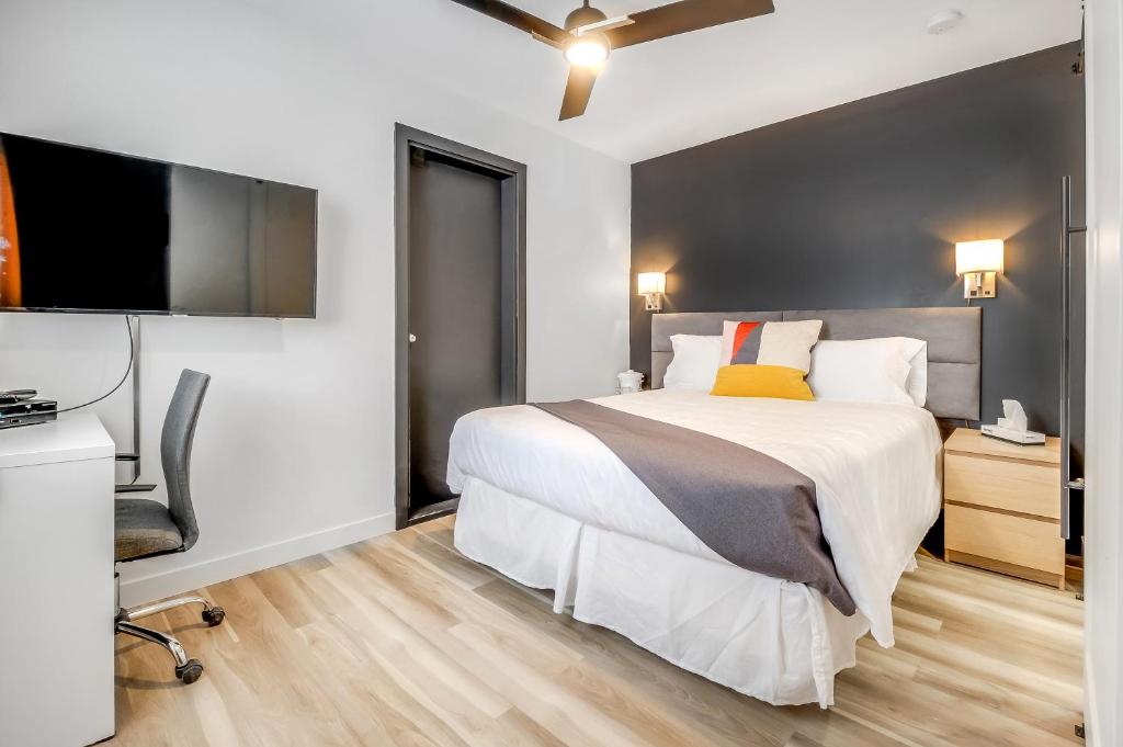 Postel nebo postele na pokoji v ubytování Motel Lévis