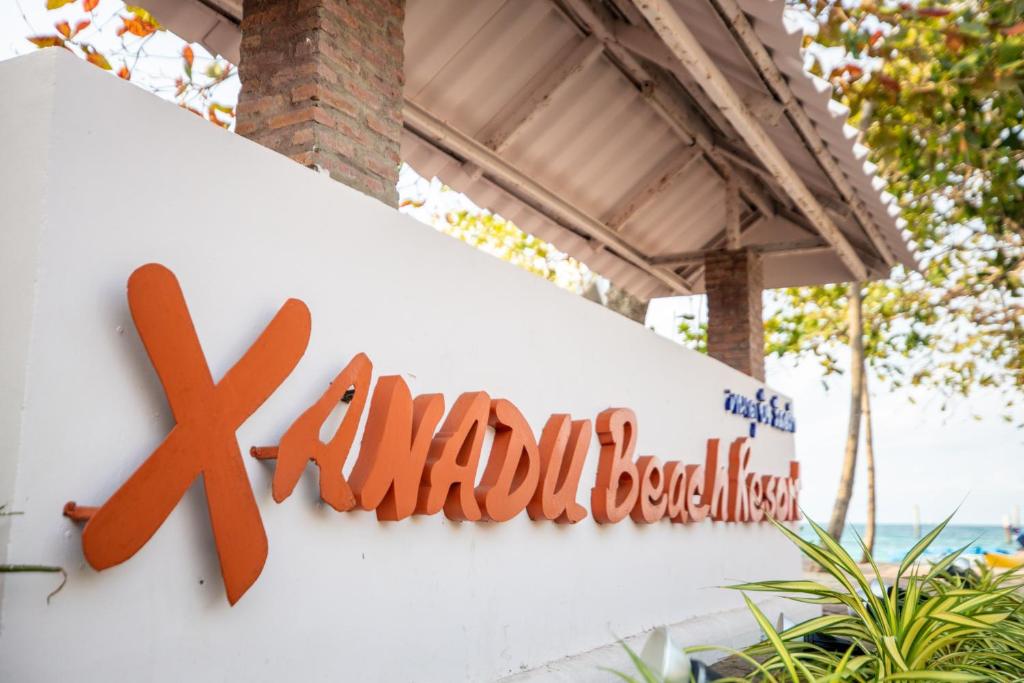 a sign for a malibu resortsinstein sign on a building at Xanadu Beach Resort in Ko Larn