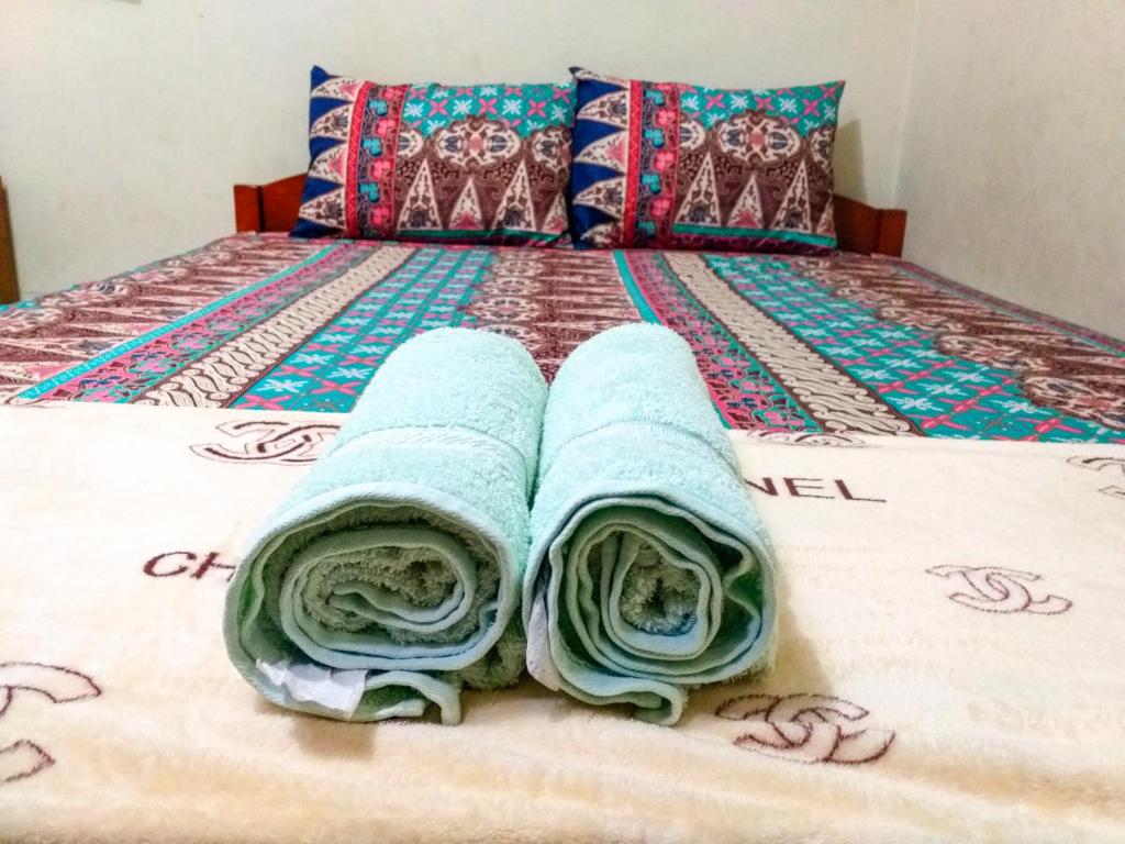 Letto o letti in una camera di Ngampilan Backpacker Hostel