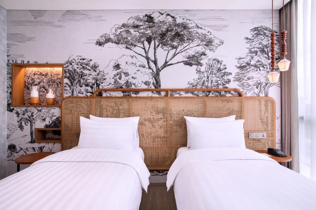 Letto o letti in una camera di Mercure Tangerang BSD City