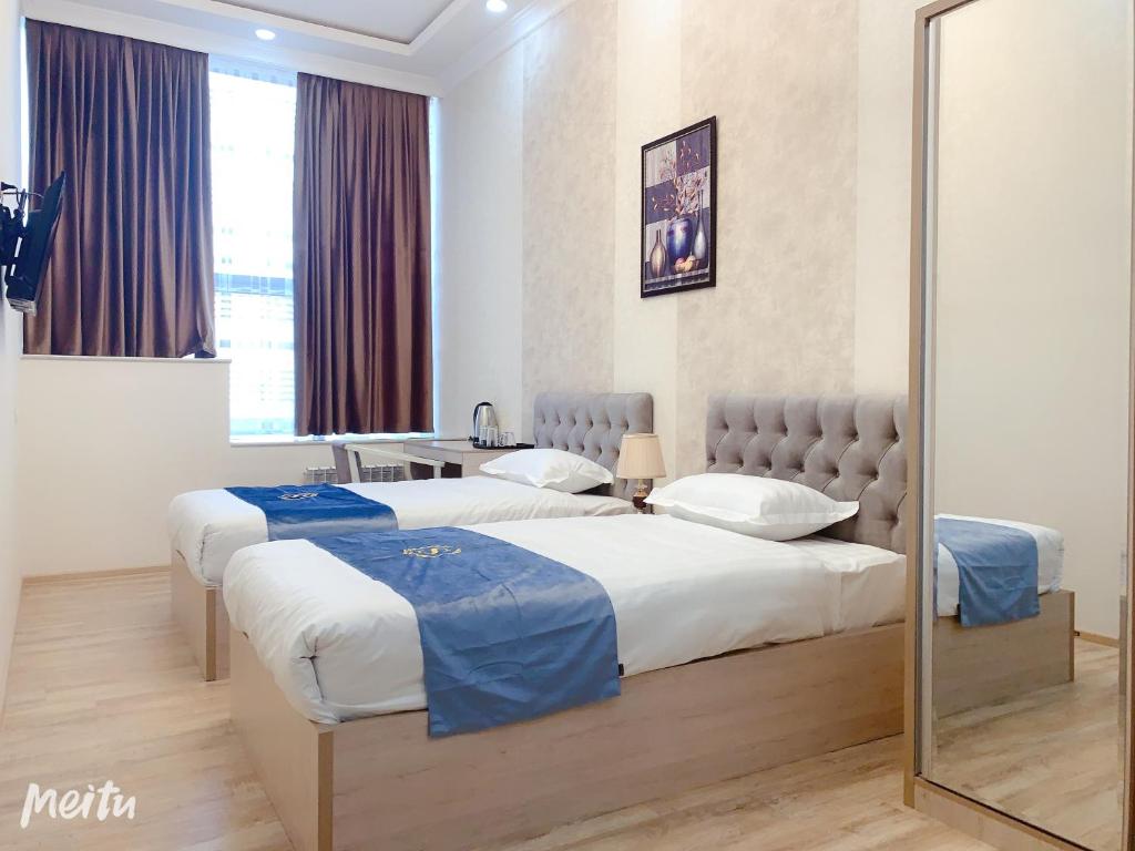 Ένα ή περισσότερα κρεβάτια σε δωμάτιο στο WANTONG HOTEL