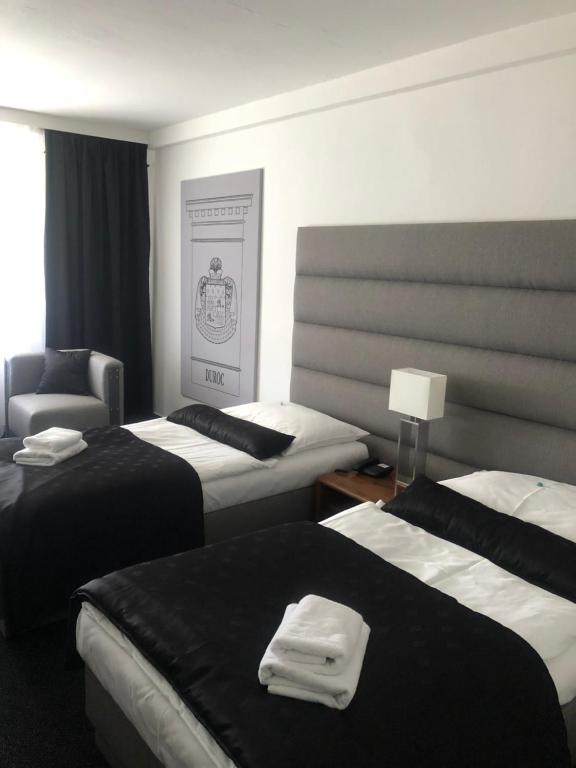 Postel nebo postele na pokoji v ubytování A-Austerlitz Hotel