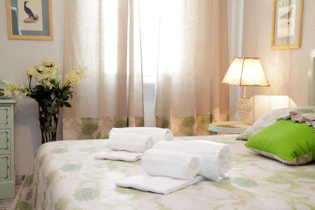 Uma cama ou camas num quarto em Restart Accommodations Rome