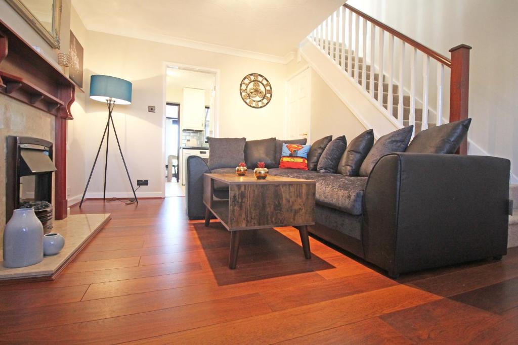 a living room with a couch and a table at The Barwoods - Modern Spacious Home in Chester - Parking in Chester