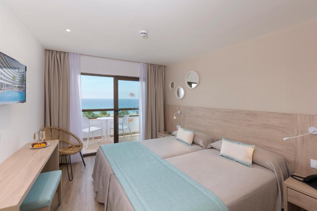 Postel nebo postele na pokoji v ubytování HSM Linda Playa