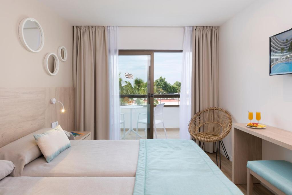 Postel nebo postele na pokoji v ubytování HSM Linda Playa