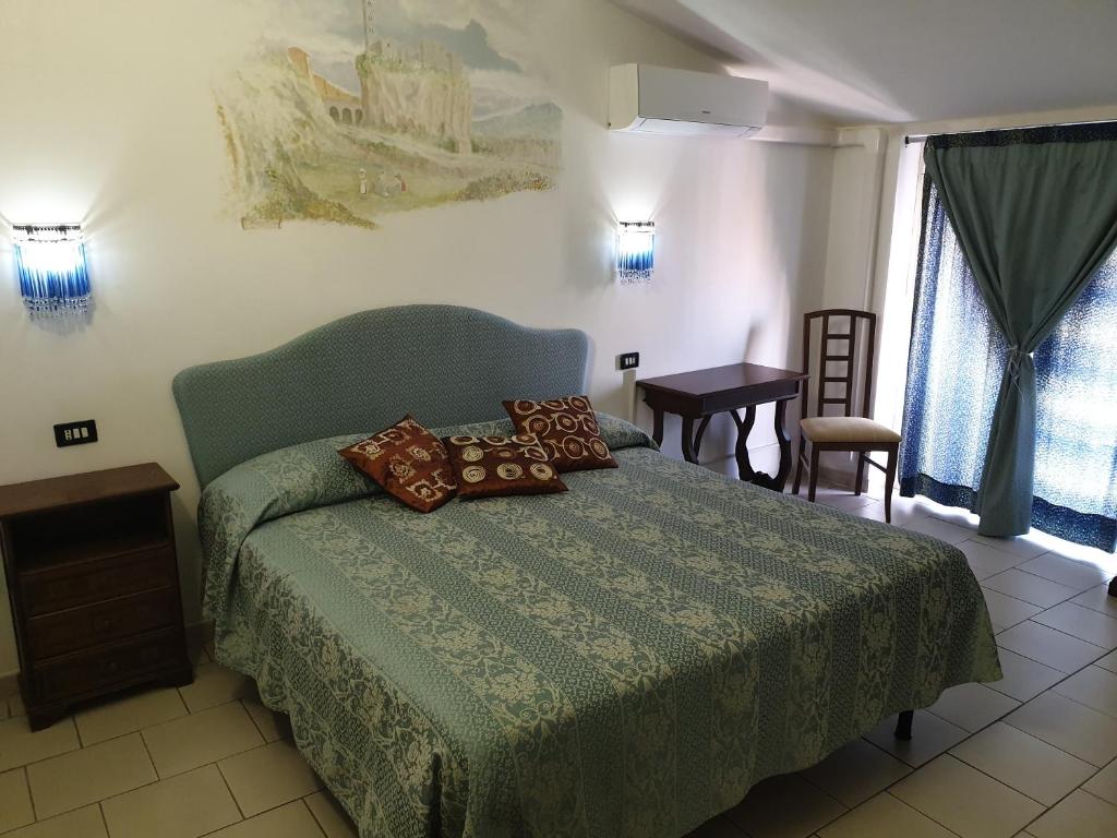Postel nebo postele na pokoji v ubytování Hotel Ristorante Bagnaia