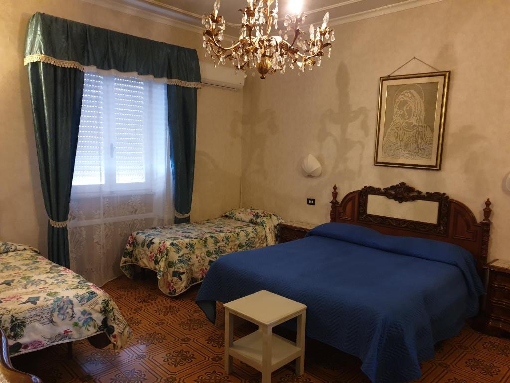 Postel nebo postele na pokoji v ubytování Hotel Ristorante Bagnaia