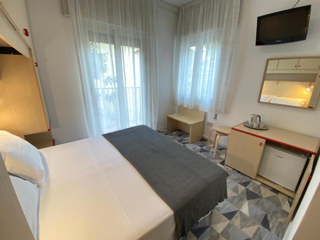 Postel nebo postele na pokoji v ubytování Giovanna Rooms